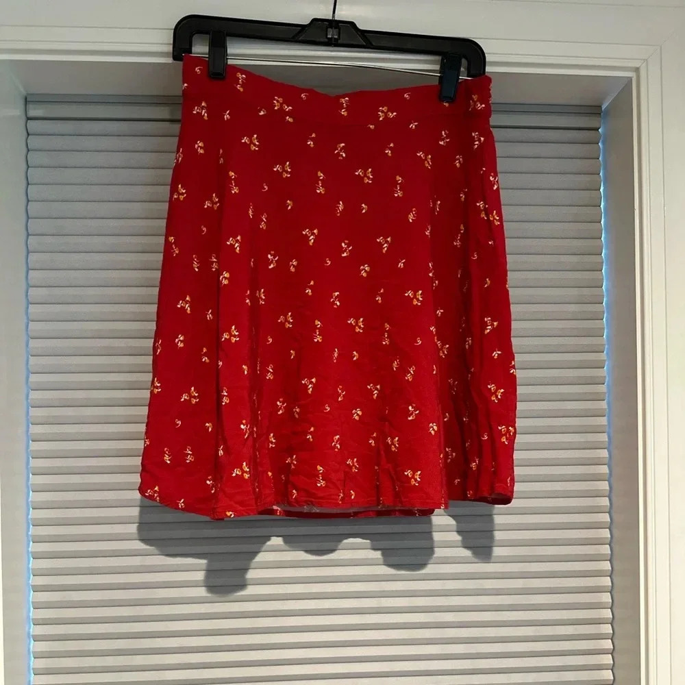 ModCloth knee-length skirt. Red with dainty yellow floral print. D-11